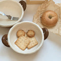 Handmade ceramic bowl with cookies and bagel, perfect for breakfast or snacks